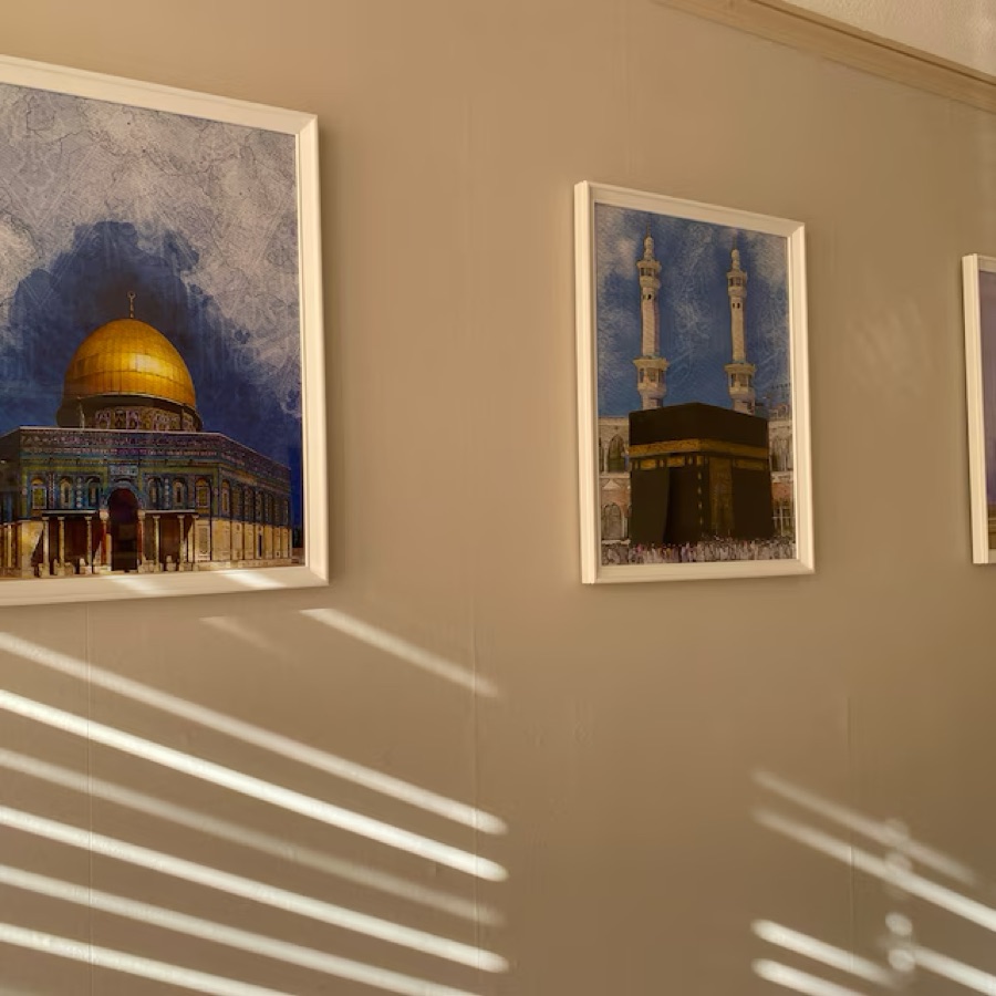 Customer photo: prints in white frames along a hallway